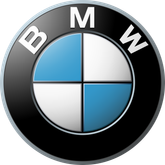 A circular emblem features the letters B, M, and W surrounding a blue and white checkered pattern