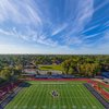 An aerial shot of a football field (John Carroll University) with a track around it.