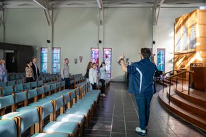 Guide Gesturing Chapel Stained Glass