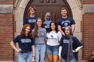 Students Group Pose Arched Wooden Door