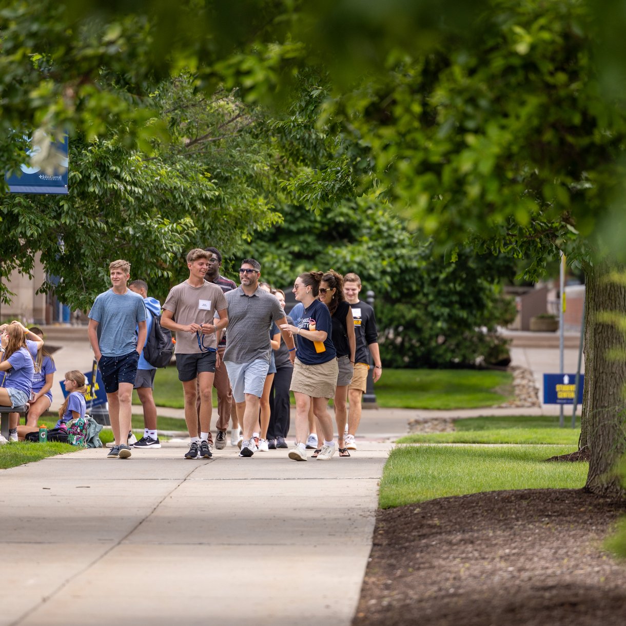 John Carroll students walking together on a campus tour near the Student Center.