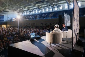 * Image Description: A large indoor arena/gymnasium (John Carroll University).