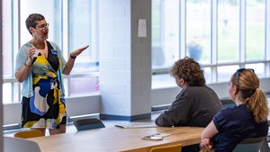 Staff Speaking Students Communal Table