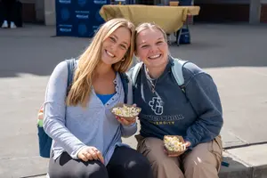 JCU campus life - two students sitting on chairs