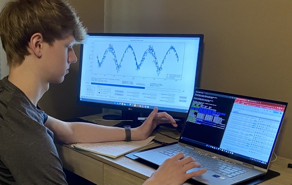 Jacob Juvan looking at data on a computer screen