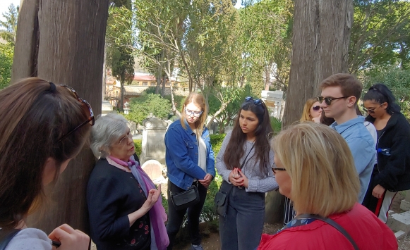 JCU students visiting Shelley's tomb in Italy listening to a British traveller.
