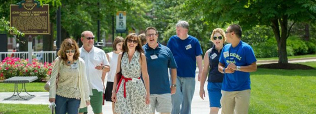 Group of JCU alumni walking on campus