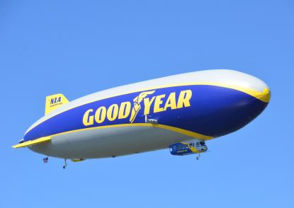 Wingfoot One flies against a scenic blue sky