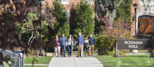 Group starting campus tour outside of Rodman Hall